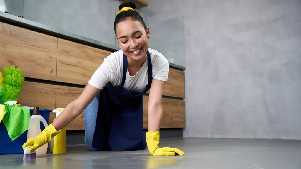 young-women-smiling-while-cleaning-house-edited-1024x576